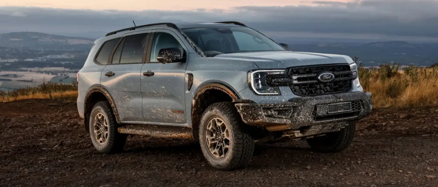Grey Everest side view on muddy ground