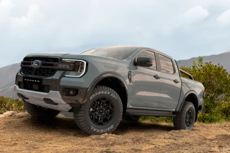 Gray Ford Ranger parked on a rugged dirt trail