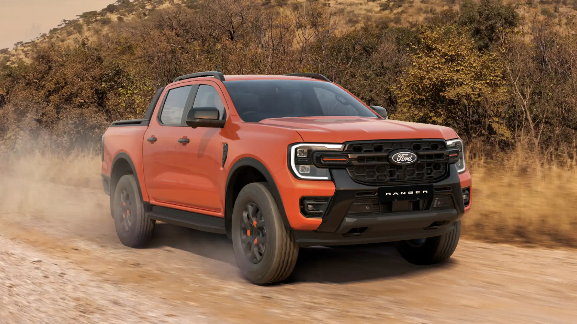 Ford Ranger driving on dirt road off-road.