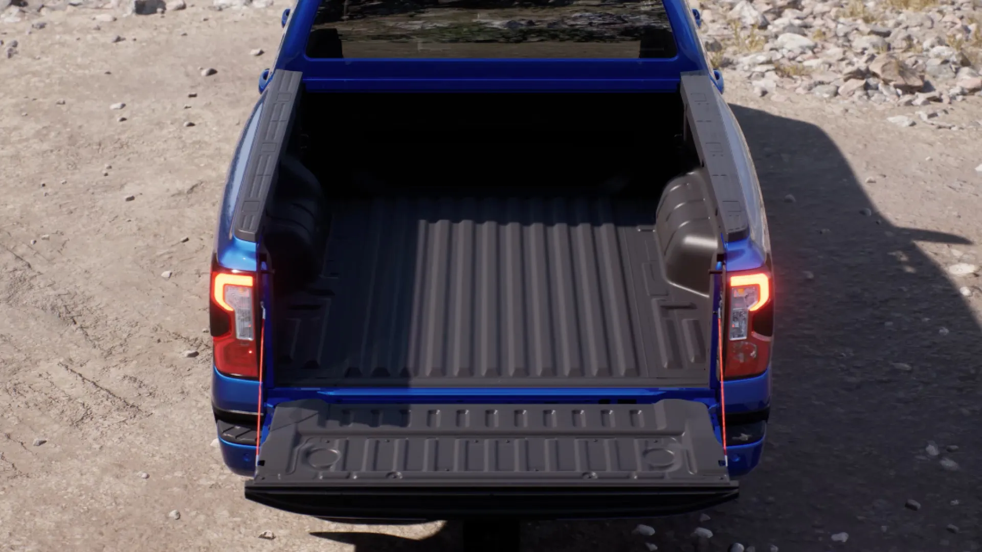 Ford Ranger open tailgate cargo bed view.