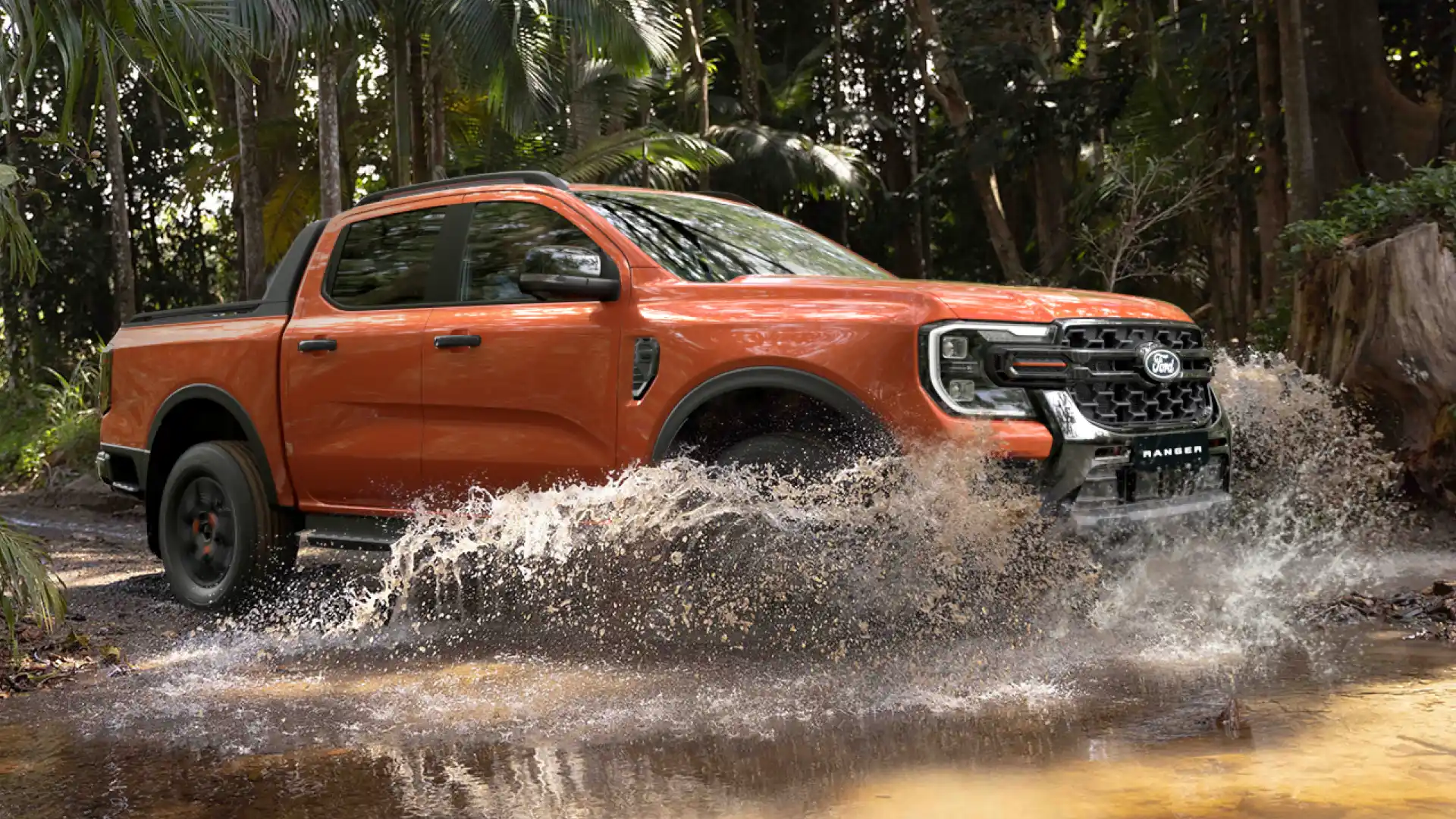 Ford Ranger driving through water on off road trail.