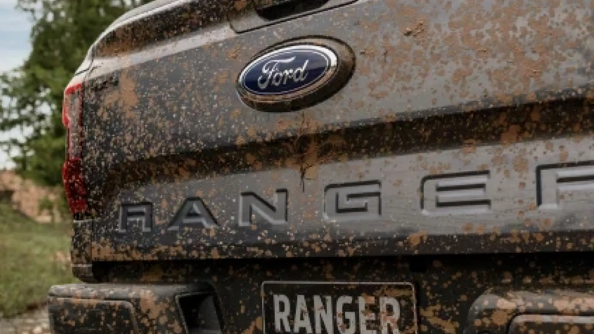 mud covered ford ranger tailgate close up