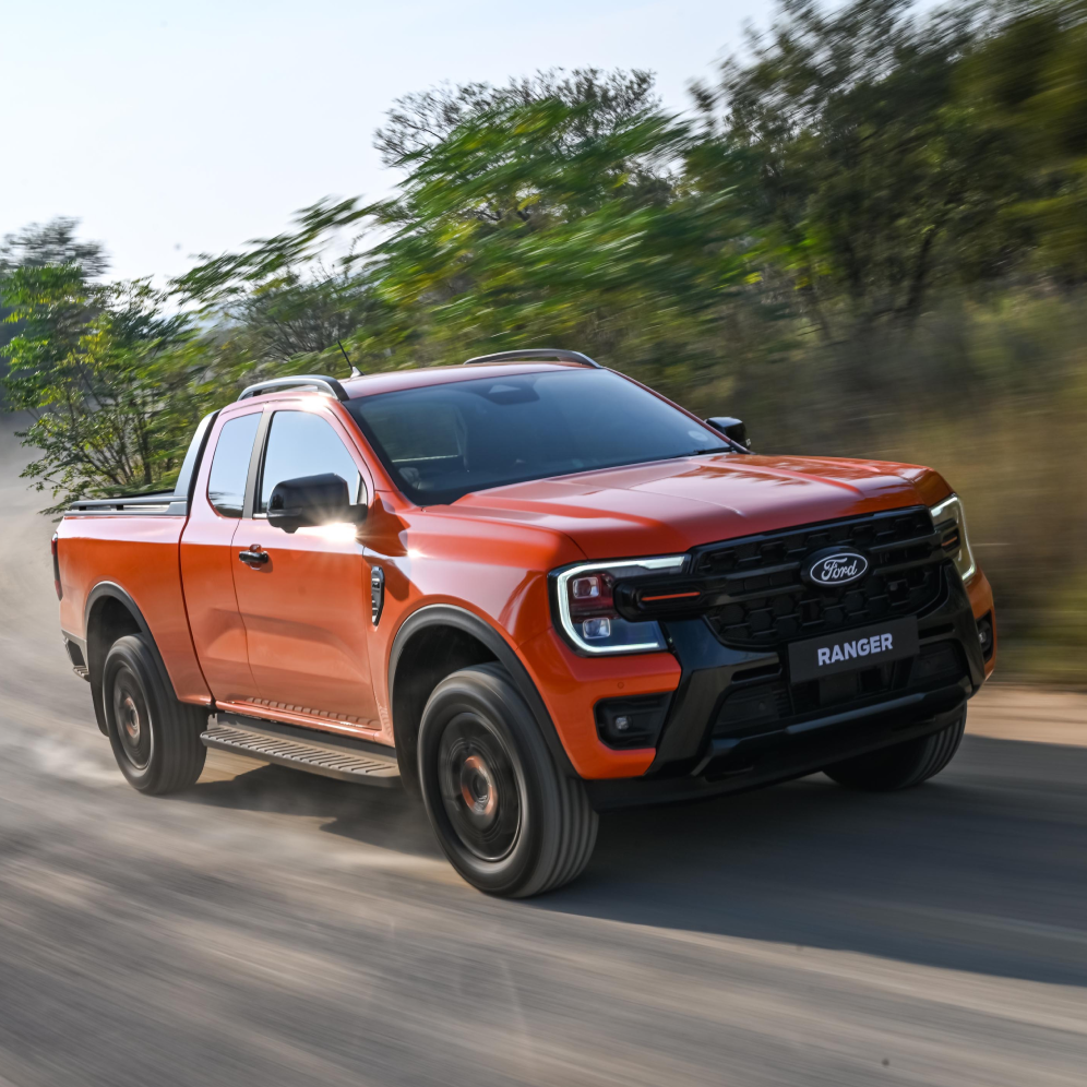An orange Ford Ranger on the road
