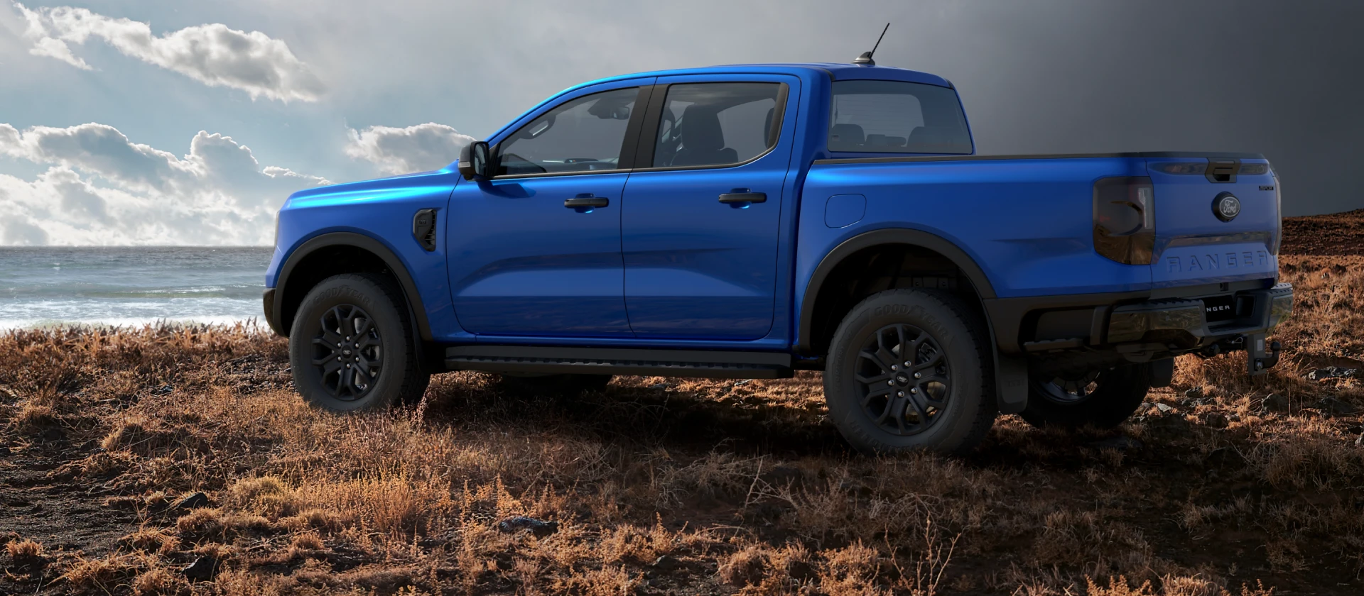Rear view of blue lightning Ford Ranger Sport parked outdoors