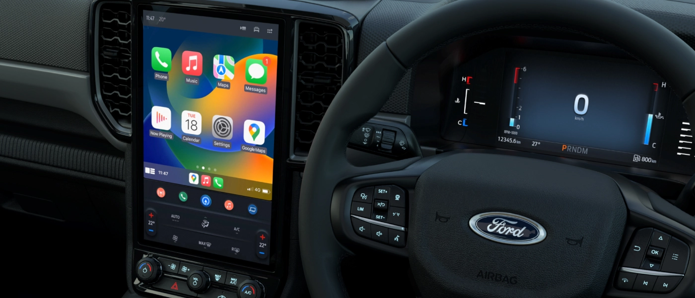 Ford interior featuring a digital dashboard and a large touchscreen with Apple CarPlay