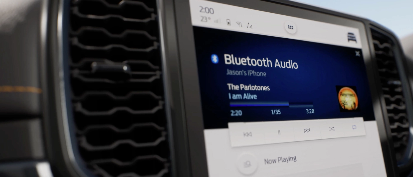 A close-up of the infotainment screen showing Bluetooth audio playback
