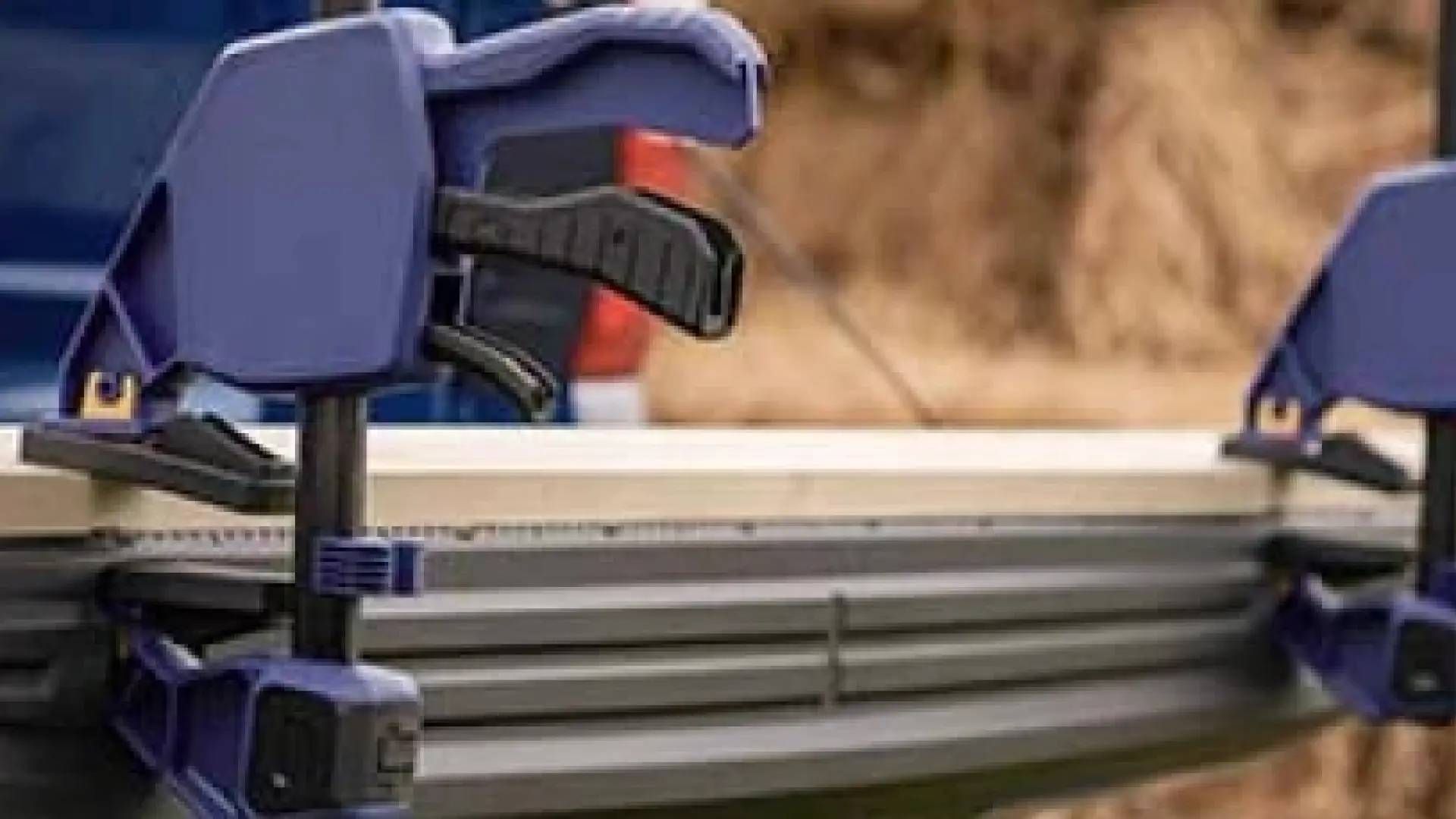 close up view of two blue clamping devices