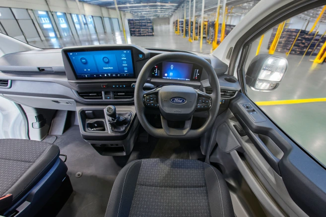 Driver cockpit and dashboard inside Ford Transit van