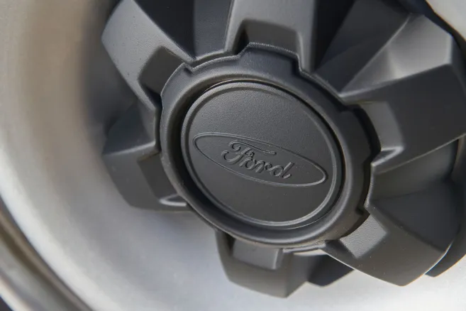 Ford logo on black wheel hub cap