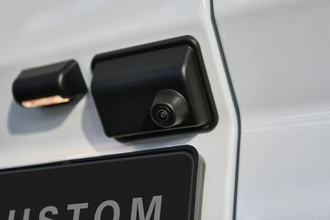 Rear backup camera close-up on white van