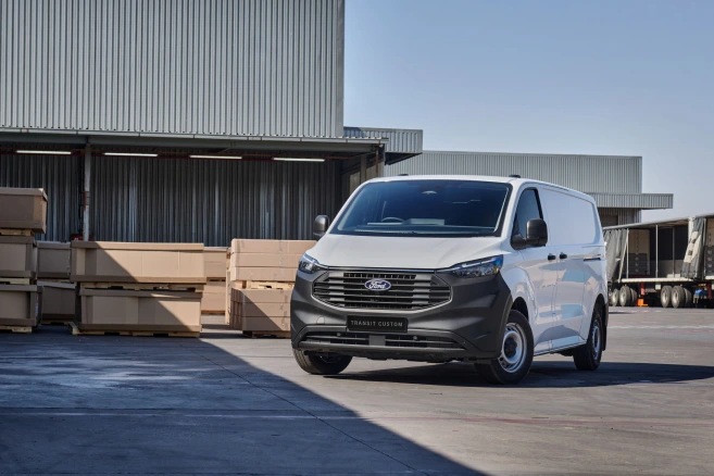White Ford Transit custom front view