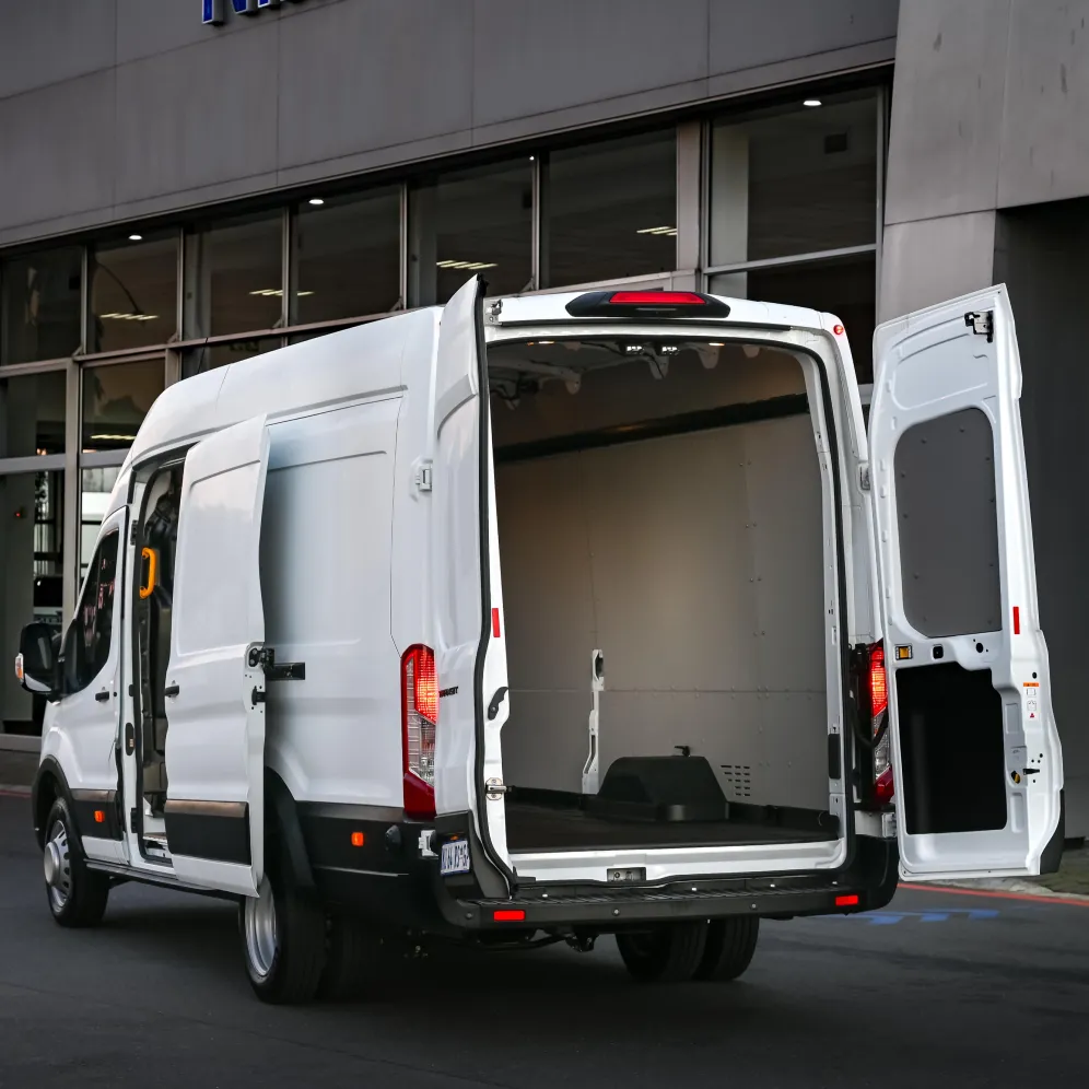 White Ford Transit van with open rear cargo doors